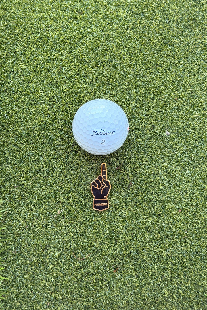 Golf ball with a Titleist logo on a green grass surface