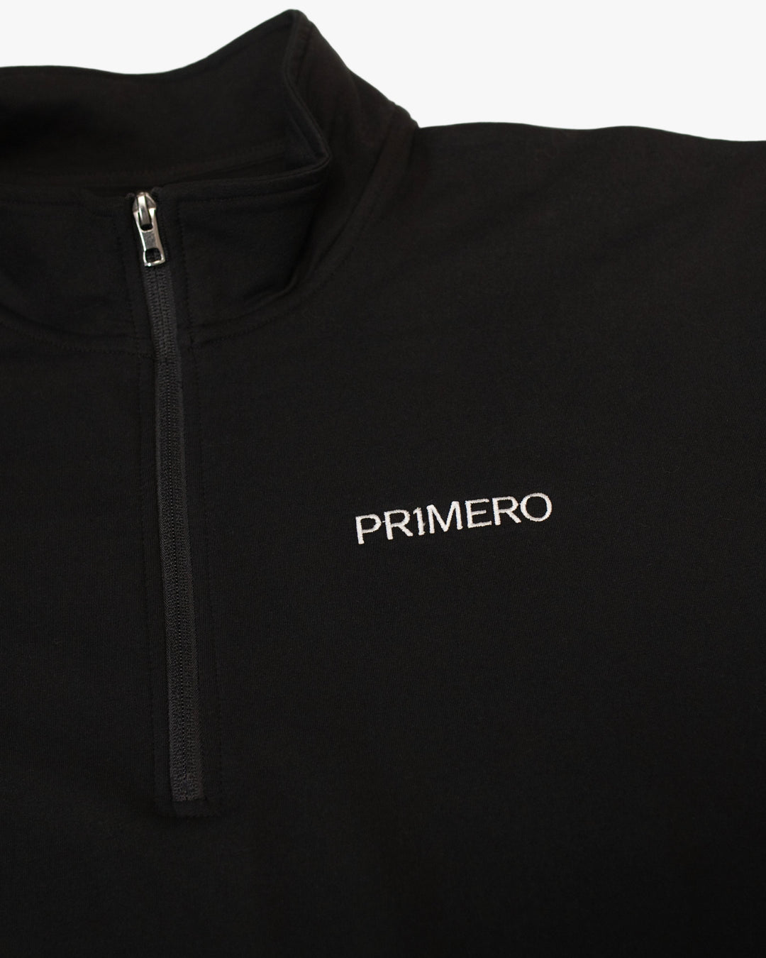 Black quarter-zip pullover with 'PRIMERO' logo on a white background